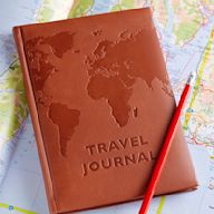 A small notebook designed for use while travelling. Often comes with prompts for daily journaling, as well as space for ticket stubs, photos, and other mementos.