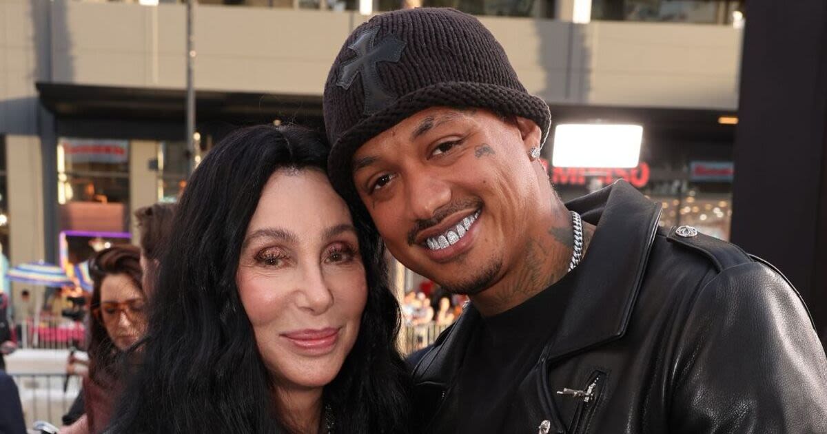 Cher and younger boyfriend Alexander Edwards pack on the PDA in matching outfits