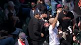 Giants fan catches foul with baby in other arm