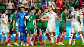 Fiery soccer game between US and Mexico ends early amid homophobic chants