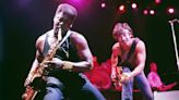 Bruce Springsteen watches Clarence Clemons play the saxophone during a Dec. 11, 1984, concert before 23,000 fans in Rupp Arena in Lexington, Kentucky.