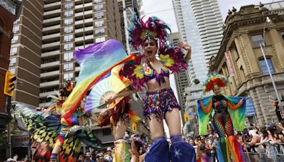 Thousands sing, dance and celebrate at Pride Parade until protesters strand marchers and floats mid-route