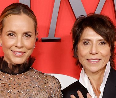 Maria Bello, 56, and star chef Dominique Crenn pose with wedding rings