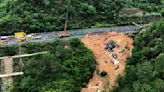 Death toll jumps to at least 48 in southern China highway collapse as search continues