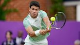 Carlos Alcaraz hopes to thrive on grass this summer after advancing at Queen’s