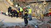 Four killed, dozens trapped in building collapse in South Africa
