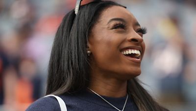 Simone Biles Bared Her Navel In A Cropped Bears Top & Teeny Skirt