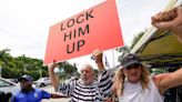 Demonstrators gather outside Trump's Doral club as the ex-president arrives in Florida for his arraignment: 'Lock him up!'