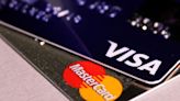 US banks to see modest hit from deal to lower swipe fee by Visa, Mastercard