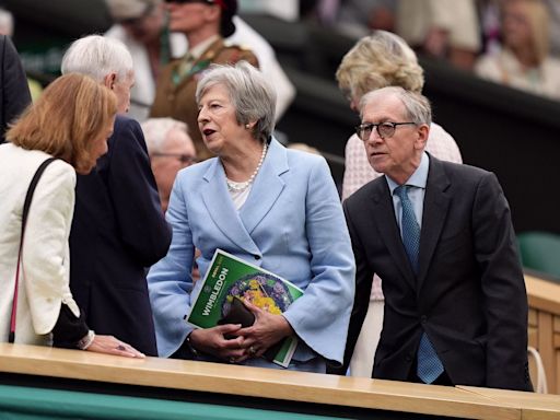 Theresa May and Romeo Beckham among spectators on drizzly day three of Wimbledon