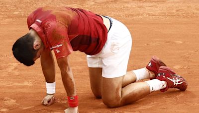 Novak Djokovic overcomes injury scare in five-set thriller at French Open