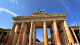 14 climate activists arrested for spray-painting Berlin’s iconic Brandenburg Gate bright orange