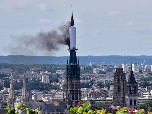 Fire inside Rouen cathedral spire as fighters battle to contain blaze