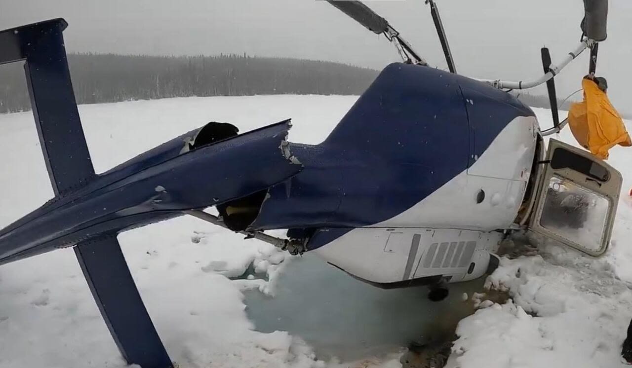 Pilot escapes with minor injuries after upside-down helicopter crash on frozen lake