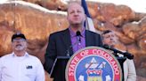 Colo. Gov. Jared Polis addresses members of the media gathered at Red Rocks