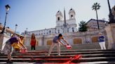 Women's rights activists cover Rome's Spanish Steps in red paint