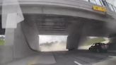 Video shows moment truck hauling gravel slams into overpass on I-94 in Detroit