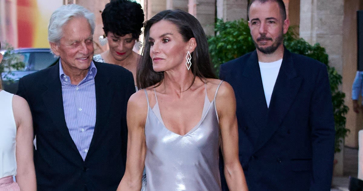 Queen Letizia Channels ’90s Kate Moss In a Plunging Silver Slip Dress