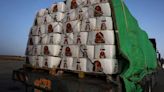 Aid trucks arrive in Gaza but no deliveries yet - sources