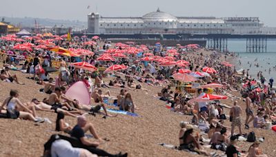 Brits head to the beach and flock to Glastonbury in 31C scorcher