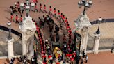 Tearful mourners line London streets to watch Queen's coffin leave Buckingham Palace