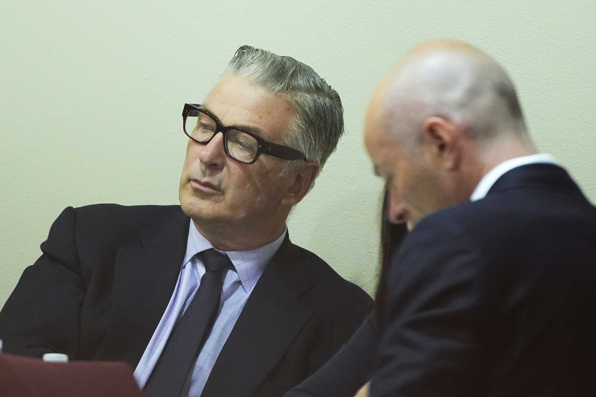 Alec Baldwin weeps in court when judge announces involuntary manslaughter case dismissed mid-trial