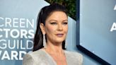 Catherine Zeta-Jones, 51, is still hula-hooping — this time, in a striped bikini