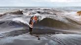 Jamie O’Brien Surfs Oil-Glass Waimea River
