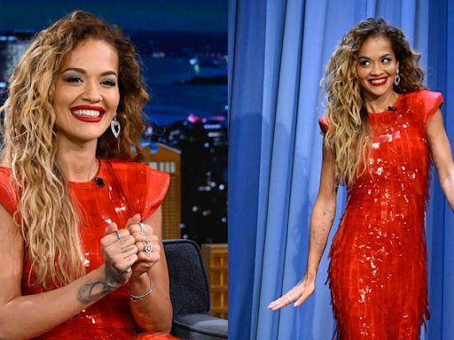 Rita Ora Embraces Futuristic Flairs in Red Sportmax Dress With Sharp Shoulders for ‘Jimmy Fallon’ Appearance, Talks ‘Descendants...