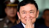 Thai King cuts ousted former leader Thaksin Shinawatra’s 8-year prison sentence to 1 year