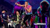 Coldplay halts concert in Athens after comedian attempts to rush stage with Israeli flag and falls