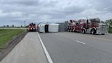 Driver suffers minor injuries after semi-trailer rolls on highway, blocking traffic for several hours