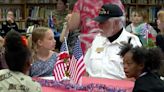 After exchanging handwritten letters, fourth grade students meet their veteran pen pals