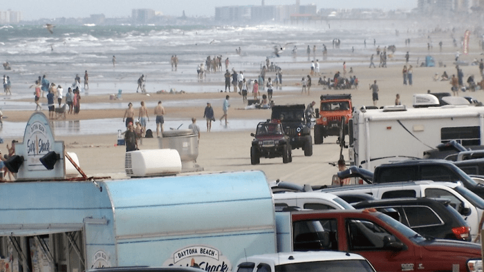 Florida beachgoers arrive before sunrise to stake spot in sand on Memorial Day