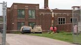 1 killed, 1 hurt when workers fall into shaft from roof to basement at Detroit school