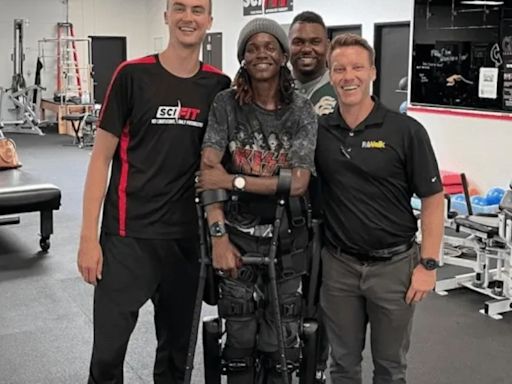 Watch as paralysed tennis player walks with help of robot exoskeleton