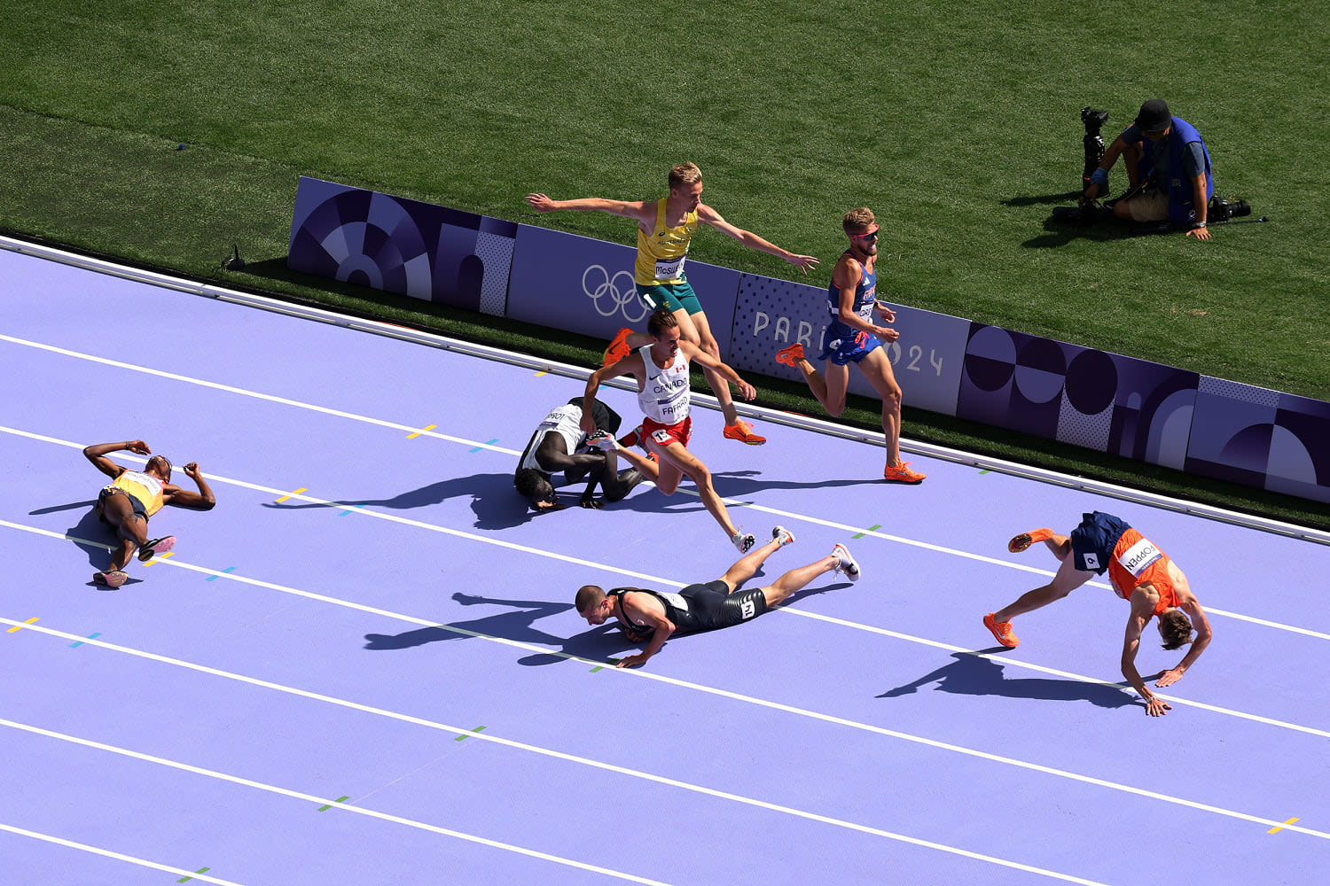 Four runners who fell in calamitous 5,000m heat advance to final