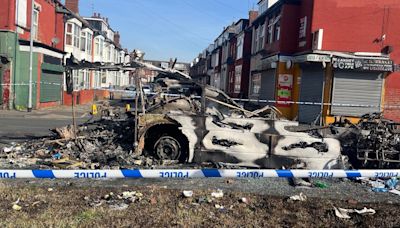 Vehicles set alight and police car overturned amid disorder in Leeds suburb