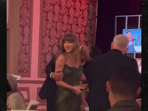 Travis Kelce Covers Taylor Swift's Arm With Kisses At Las Vegas Gala