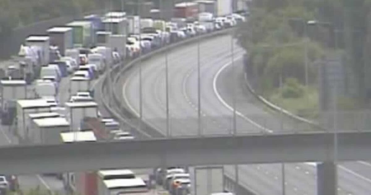 Traffic backs up on busy motorway after major crash as air ambulance lands