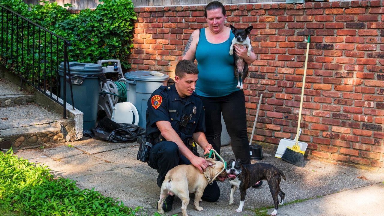 Suffolk Police Officer Matthew Ingui saves dogs in Rocky Point house fire