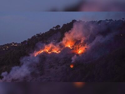 Massive wildfire engulfs northern California, firefighters rescue