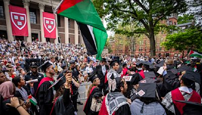 Students walk out of Harvard College graduation; UCLA contends with new protest