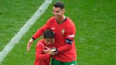 Cristiano Ronaldo embraces young pitch invader against Turkey