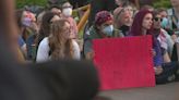 Large group of anti-war protestors gather at Saint Louis University