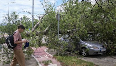 A powerful summer storm sweeps through Balkans with hail, rain and winds, killing 2