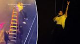 Chris Brown gets stuck dangling in the air during concert, rescued by ladder