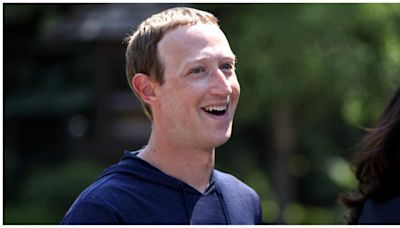 Mark Zuckerberg goes surfing in a tuxedo, with a beer & US flag on 4th of July. No, its not AI