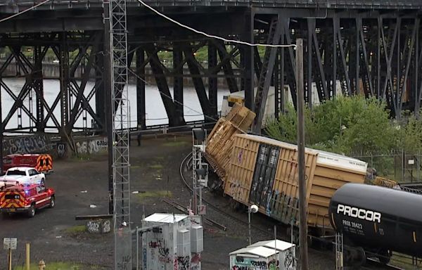 A train derailment shuts down a historic bridge that carries cars and trains in Portland, Oregon