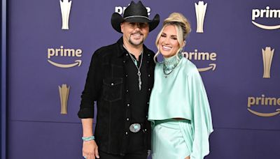 Jason Aldean, wife Brittany share steamy kiss at Disneyland during family trip